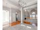 Open concept dining area with hardwood floors and views to the Gathering room and kitchen at 5839 Painted Fern Ct, Charlotte, NC 28269