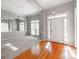 Bright dining room features hardwood floors, neutral walls, and a stylish light fixture at 5839 Painted Fern Ct, Charlotte, NC 28269