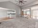 Open Gathering room with kitchen views and access to upper level at 5839 Painted Fern Ct, Charlotte, NC 28269