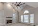 Spacious Gathering room with vaulted ceiling, fireplace, and built-in shelving at 5839 Painted Fern Ct, Charlotte, NC 28269