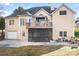 Back of house with deck, gazebo, screened porch, and garden at 5839 Painted Fern Ct, Charlotte, NC 28269