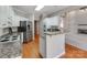 Modern kitchen with granite countertops, stainless steel appliances, and breakfast bar at 5839 Painted Fern Ct, Charlotte, NC 28269