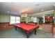 Game room with a pool table and brick accents at 5839 Painted Fern Ct, Charlotte, NC 28269