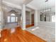 Two story entry with hardwood floors, neutral paint, and views to the Gathering room at 5839 Painted Fern Ct, Charlotte, NC 28269