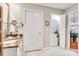 Bathroom featuring a vanity with granite countertops, and a laundry closet with stacked washer and dryer at 721 Governor Morrison St # 425, Charlotte, NC 28211