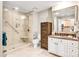 Modern bathroom with a glass-enclosed shower, a vanity with granite countertops, and a large mirror at 721 Governor Morrison St # 425, Charlotte, NC 28211
