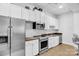Well-equipped kitchenette area featuring stainless steel appliances and white cabinetry at 721 Governor Morrison St # 425, Charlotte, NC 28211