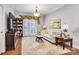 Cozy living room featuring hardwood floors, a comfortable sofa, and elegant decor, creating a warm and inviting atmosphere at 721 Governor Morrison St # 425, Charlotte, NC 28211