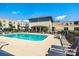 Community pool with lounge chairs and tables, great for relaxing or entertaining at 721 Governor Morrison St # 425, Charlotte, NC 28211