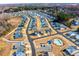 Expansive aerial view of a neighborhood featuring single-Gathering homes, community pool, and landscaping at 7669 Tanglewood Way, Denver, NC 28037