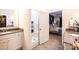 Bathroom with a glass-enclosed shower, double sink vanity, and access to the main bedroom at 7669 Tanglewood Way, Denver, NC 28037