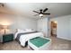 Well-lit bedroom featuring a bed, a desk area, and large windows at 7669 Tanglewood Way, Denver, NC 28037