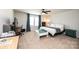 Well-lit bedroom featuring a bed, a desk area, and large windows at 7669 Tanglewood Way, Denver, NC 28037