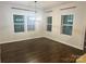 Bright dining room with a chandelier and many windows providing ample natural light at 7669 Tanglewood Way, Denver, NC 28037