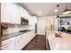Stylish kitchen featuring white cabinets, stainless steel appliances, and a spacious center island at 7669 Tanglewood Way, Denver, NC 28037
