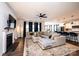 Spacious living room with a fireplace, comfortable seating, and an open layout at 7669 Tanglewood Way, Denver, NC 28037