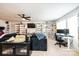 Spacious living room with black couch, shelves of Lego sets, and a desk space at 7669 Tanglewood Way, Denver, NC 28037