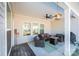 Cozy outdoor patio featuring comfortable seating and a ceiling fan at 7669 Tanglewood Way, Denver, NC 28037