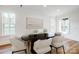 Elegant dining room with modern table and chairs, complemented by natural light and hardwood floors at 901 Edgemont Ave, Belmont, NC 28012