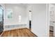 Entryway boasts shiplap walls, built-in bench seating, and a view of the adjacent bathroom at 901 Edgemont Ave, Belmont, NC 28012
