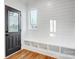 Entryway with shiplap walls, built-in bench with cubbies, and a black front door offers a welcoming entrance at 901 Edgemont Ave, Belmont, NC 28012