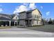 Charming two-story home featuring manicured landscaping and a long driveway leading to the property at 901 Edgemont Ave, Belmont, NC 28012