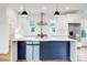 Kitchen showcases an island with a stainless steel sink, subway tile backsplash, and modern pendant lighting at 901 Edgemont Ave, Belmont, NC 28012