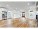 Open living space with hardwood floors and kitchen view at 901 Edgemont Ave, Belmont, NC 28012