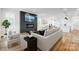 Spacious living room features a modern fireplace, open layout, and beautiful hardwood floors at 901 Edgemont Ave, Belmont, NC 28012