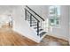 Modern staircase with dark wood treads and metal railing at 901 Edgemont Ave, Belmont, NC 28012