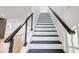 Clean staircase design featuring black handrails and minimalist styling at 901 Edgemont Ave, Belmont, NC 28012