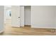 Bedroom boasts wood-look flooring, white walls, a closet, and an entrance doorway at 1423 Roseland Dr, Lincolnton, NC 28092