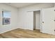 Well-lit bedroom featuring wood-look flooring, window, and closet with bi-fold doors at 1423 Roseland Dr, Lincolnton, NC 28092