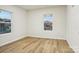 Bright, empty room with modern flooring and natural light streaming through the windows at 1423 Roseland Dr, Lincolnton, NC 28092