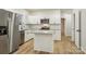 Modern kitchen featuring stainless steel appliances, white cabinets, and a central island with seating at 1423 Roseland Dr, Lincolnton, NC 28092