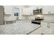 Granite counters and stainless appliances accent this modern kitchen at 1423 Roseland Dr, Lincolnton, NC 28092