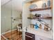 Convenient bar area with quartz countertop and shelving at 18631 Vineyard Point Ln, Cornelius, NC 28031