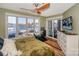 Bedroom with water view, workout equipment, dresser and balcony access at 18631 Vineyard Point Ln, Cornelius, NC 28031