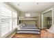 This stylish bedroom features a sturdy bunk bed and a bright window with shutter-style coverings at 18631 Vineyard Point Ln, Cornelius, NC 28031