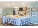 Open kitchen with quartz counters, bar stool seating, and pendant lighting at 18631 Vineyard Point Ln, Cornelius, NC 28031