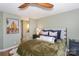 The main bedroom offers a calming retreat with its soothing color palette and plush bedding at 18631 Vineyard Point Ln, Cornelius, NC 28031
