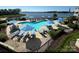 Community swimming pool, surrounded by lounge chairs and lush greenery at 18631 Vineyard Point Ln, Cornelius, NC 28031