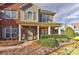 Two-story house with a covered porch, well-maintained landscaping and brick accents at 1908 Robbins Meadows Dr, Waxhaw, NC 28173