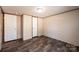 Bedroom with plank floors, two doors, and neutral walls at 3553 33Rd Street Ne Dr, Hickory, NC 28601