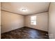 This bedroom has wood-look floors, a window, and neutral walls at 3553 33Rd Street Ne Dr, Hickory, NC 28601