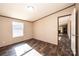 Spacious bedroom features dark wood-look floors, large windows, and neutral walls at 3553 33Rd Street Ne Dr, Hickory, NC 28601
