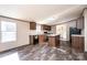 Kitchen with wood cabinets, laminate countertops, black appliances, and an island at 3553 33Rd Street Ne Dr, Hickory, NC 28601