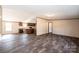 Open concept living area with view of kitchen, laminate floors, and neutral paint at 3553 33Rd Street Ne Dr, Hickory, NC 28601