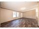 Another view of the spacious living area featuring wood-look flooring and neutral walls at 3553 33Rd Street Ne Dr, Hickory, NC 28601