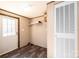 Functional mud room with modern door, convenient shelving, and durable flooring at 3553 33Rd Street Ne Dr, Hickory, NC 28601